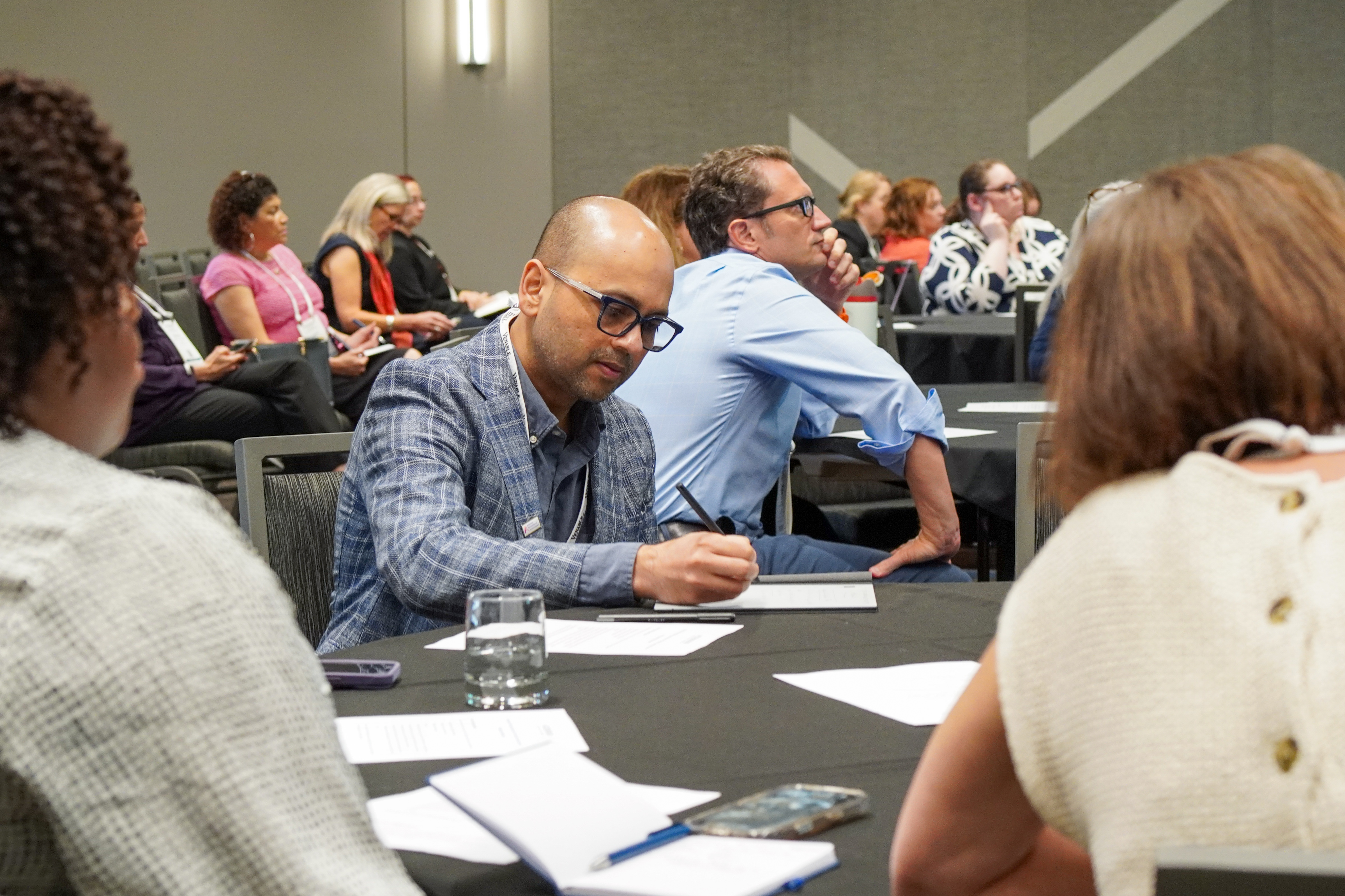 Attendee taking notes