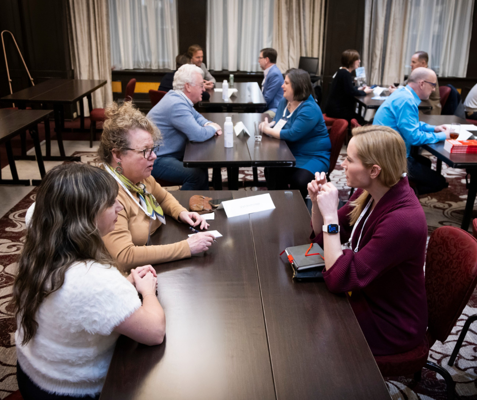 Attendees networking at a CESSE event.